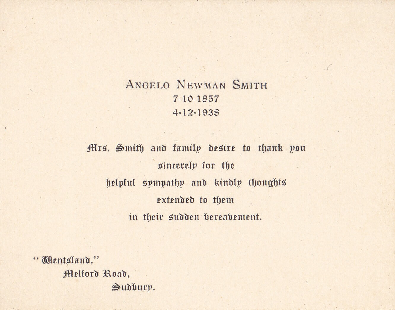 A worn out business card with company name and address