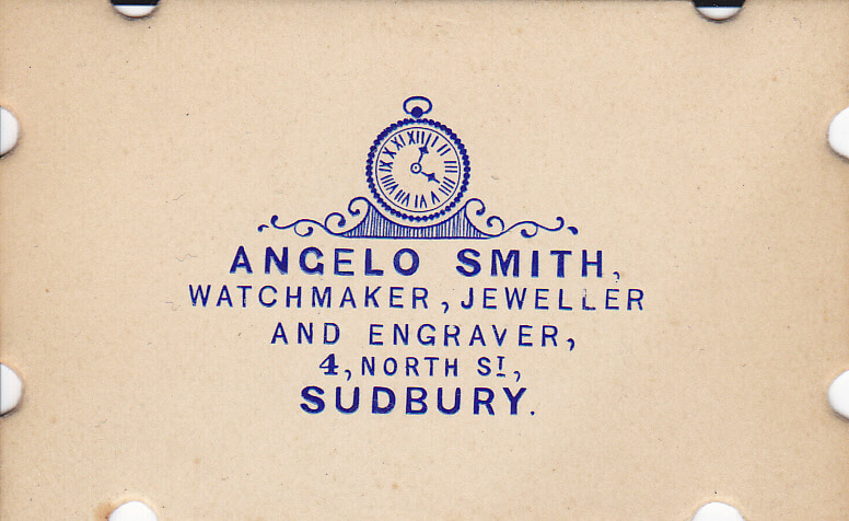 A card with the business name and address printed in blue ink