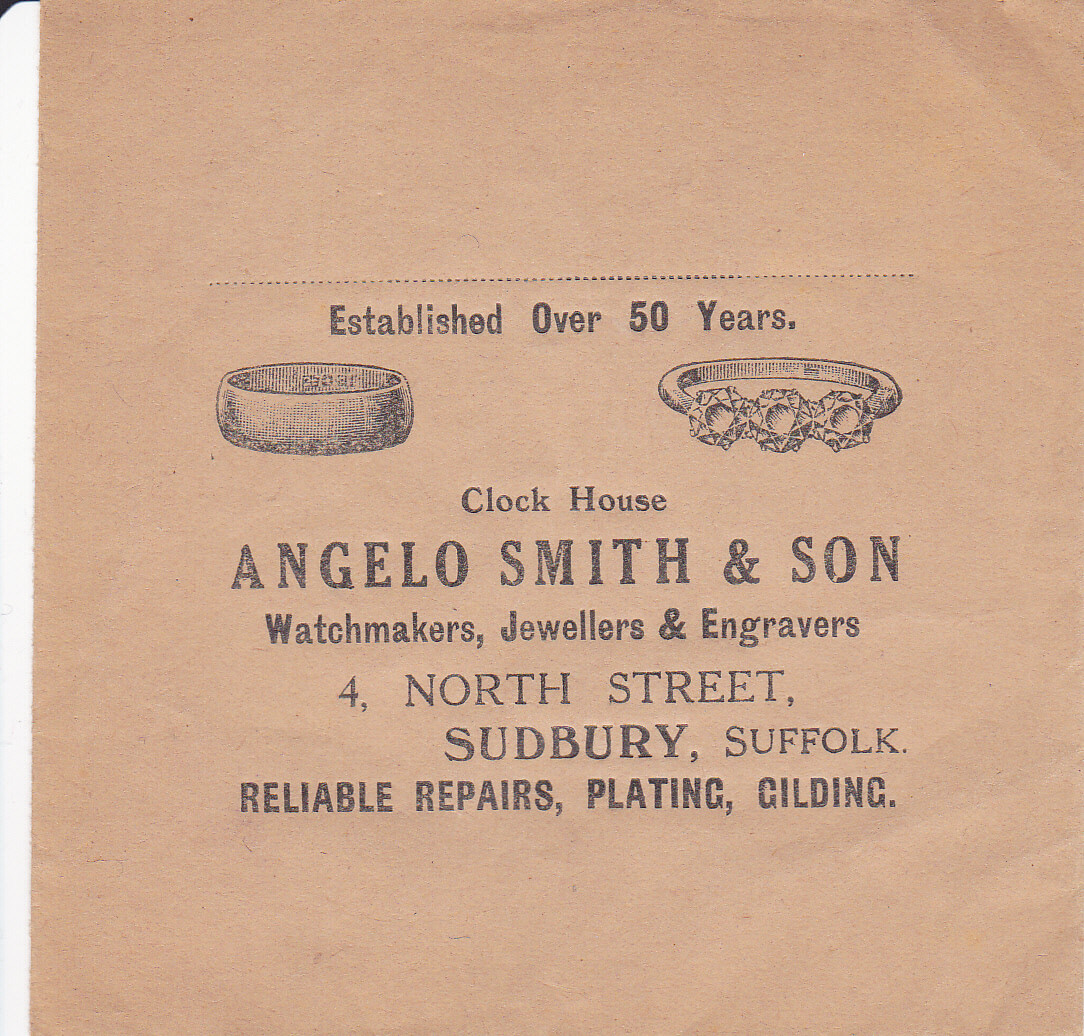 An aged envelope with the company name and address, an sketches of two rings
