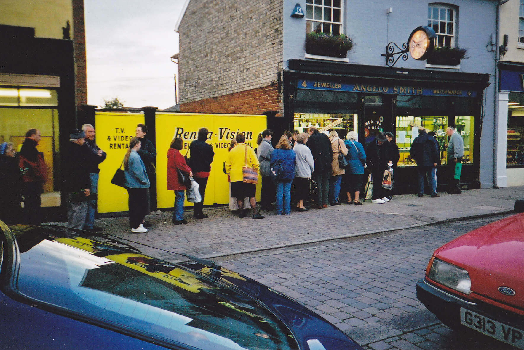 A long queue of people outside the jewellery shop